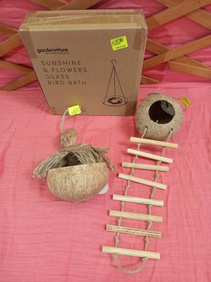 a box with a ladder, a ball of yarn, and a ball of yarn on a pink table cloth