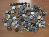 a pile of coins on a table with a lot of other coins