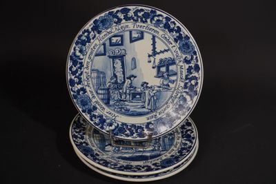 two blue and white plates sitting on top of each other