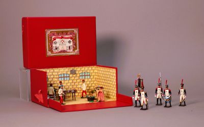 a red box with toy soldiers inside of it