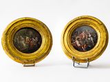 pair of paintings of a man and a woman in a gold frame