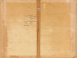 an old open book with writing on it sitting on top of a table