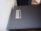 a black table with a gray top in a room
