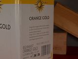 a box of orange gold sitting on a table