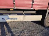the front end of a truck with the name trone on it