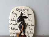 a ceramic plaque with a picture of a rabbit on it