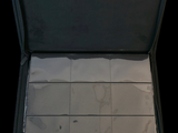 a open suitcase with a lot of papers inside of it