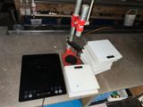 an image of a table with a laptop and other electronics
