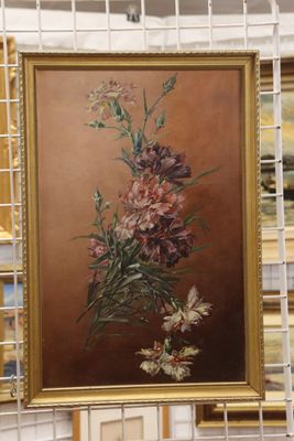 une photo d'un tableau représentant des fleurs, exposé dans un magasin