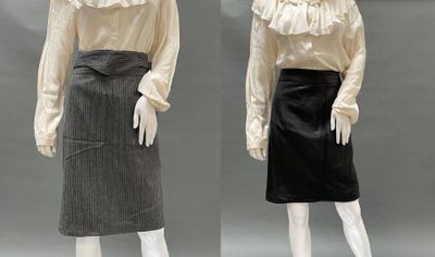 two mannequins dressed in white shirts and black skirts
