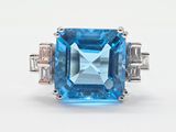 an image of a blue topazte and diamond ring on a white background