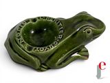 a green frog shaped ashtray on a white background