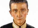 a statue of a man wearing a black jacket