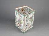 a white and green box with flowers and birds on it