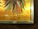 a picture of a painting of a rooster on the wall