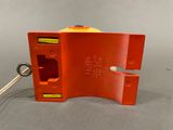 a close up of a red object with a key in it