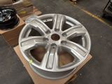 a wheel that is sitting on a cart in a warehouse