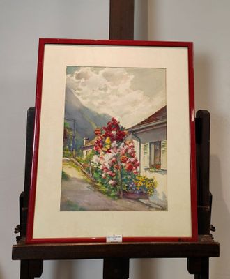 une photo d'un tableau posé sur un chevalet près d'un mur