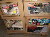 a cardboard box filled with assorted items on top of a pallet