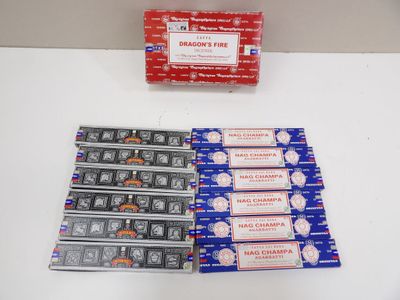 a lot of cigarettes sitting on a table next to a package of cigarettes