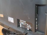 an image of a flat screen tv sitting on top of a hard wood floor