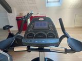 a tread machine in the middle of a gym room