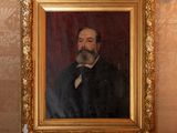 a painting of a man with a beard in a gold frame