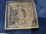 an old metal box with a picture of jesus on it