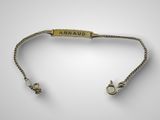 a gold bracelet with the word armadi on it