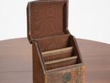 a small wooden box sitting on top of a wooden table