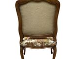 an image of a wooden chair with a floral upholstered seat