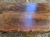 a wooden table that is sitting on the ground