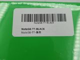 a close up of a green box with a barcode on it