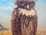 tableau représentant un hibou perché sur une branche devant un paysage désertique