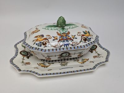 a white plate with a blue and white design on it