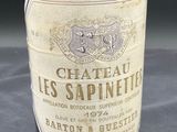 a bottle of wine that is sitting on a table
