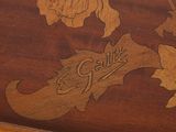 a close up of a wooden box with a design on it