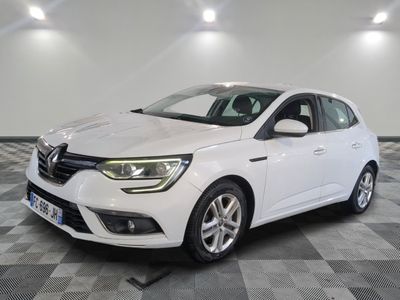 a white car parked in a room with a checkered floor