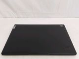 a black laptop on a white surface with a white background
