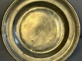 a silver plate that is sitting on a table