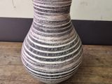 a vase that is sitting on a wooden table