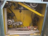 a machine that is sitting inside of a yellow box