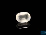 a white quartz stone on a black surface