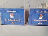 two boxes that are sitting next to each other on a table