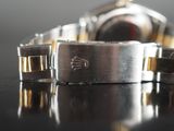 a close up of a watch on a table