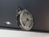 a fan that is on the side of a wall
