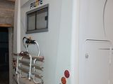 an image of a white rv parked in a garage