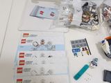 a table with a bunch of legos and a bag of legos