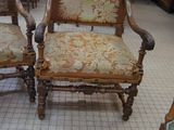 two chairs that are sitting in the middle of a room