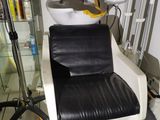 a black and white chair and a sink in a room